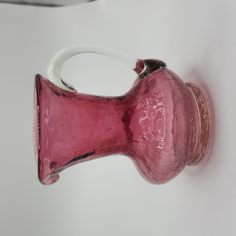 Crackle glass cranberry colored small pitcher